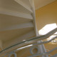 cropped photo of a residential iron spiral staircase