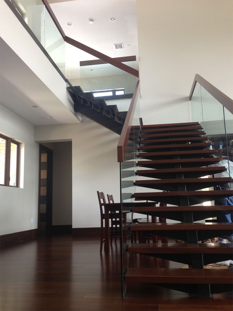 photo of a modern wooden and glass staircase