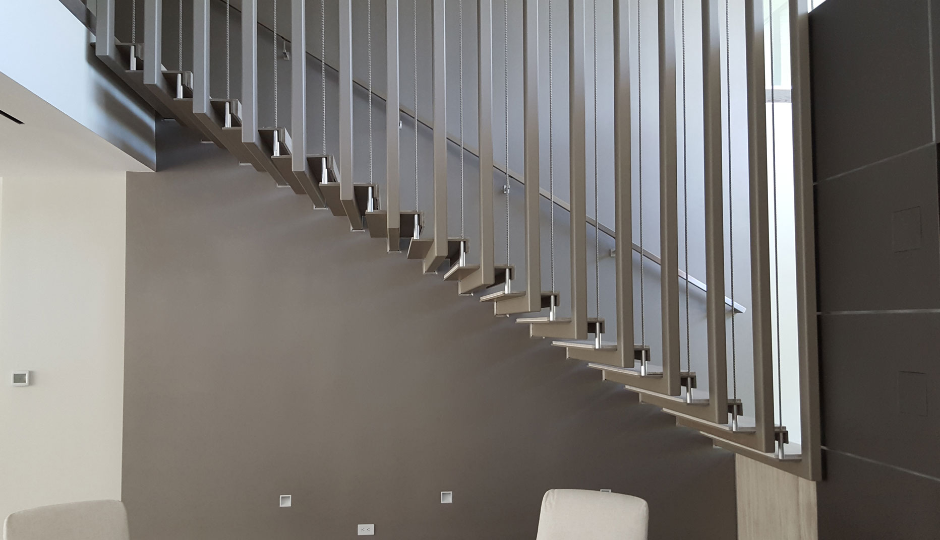 photo of a modern metal floating staircase