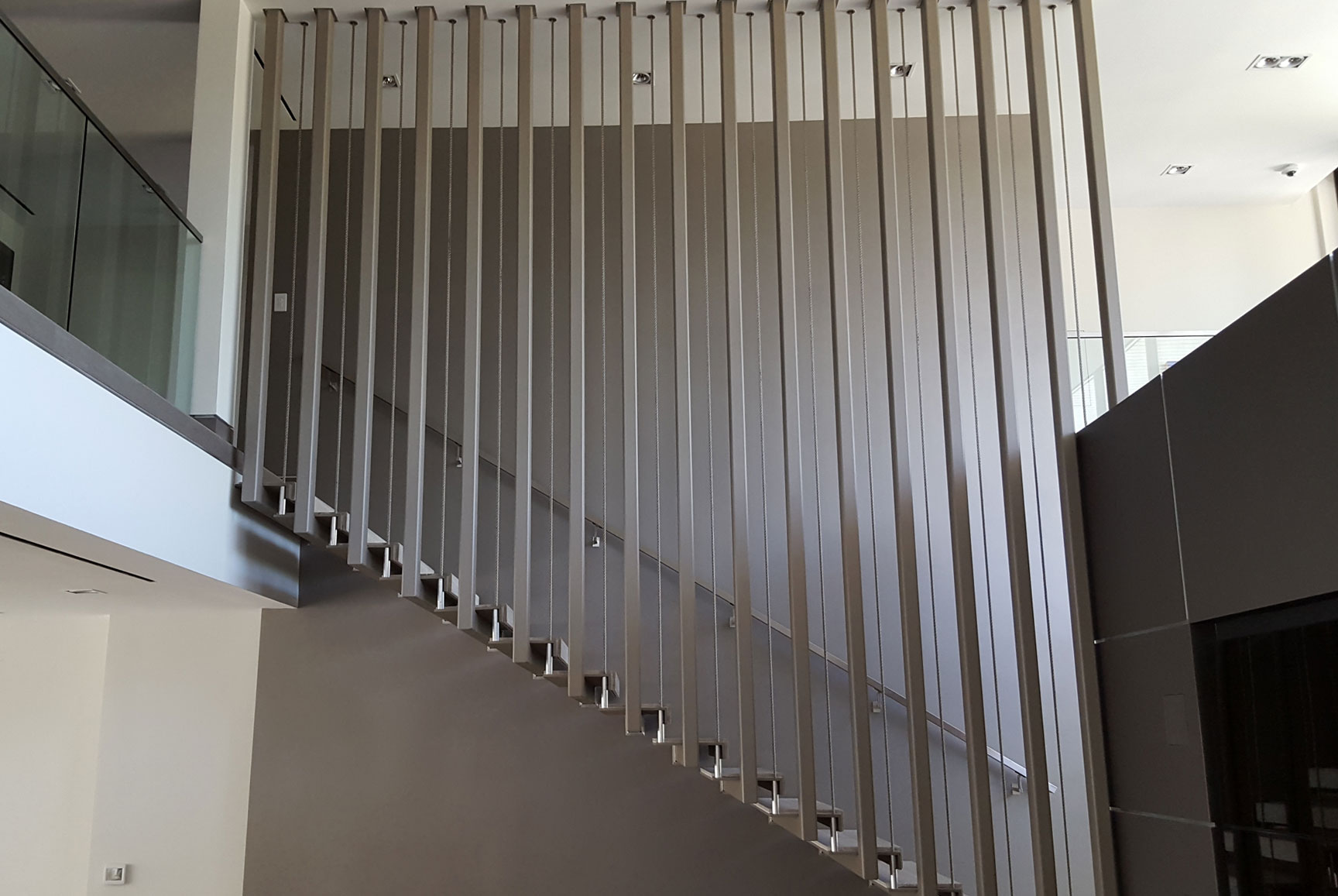 photo of a modern metal floating staircase
